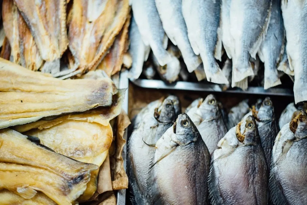 Fresh fish neatly stacked in crates at market